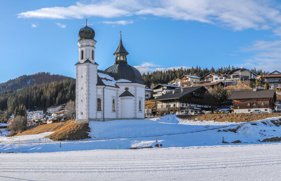 Winter panorama of Seefeld village with the church at sunset in in the Tyrolean Alps, Austria