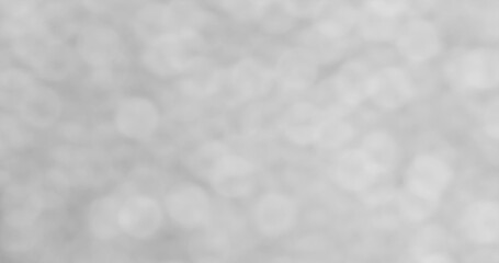 Fototapeta premium Soft light creates a blurred background with a gray and white color scheme during a winter day indoors