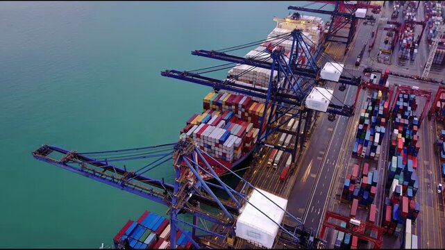 Aerial view timelapse of huge cargo ship at Hong Cong transportation hub.