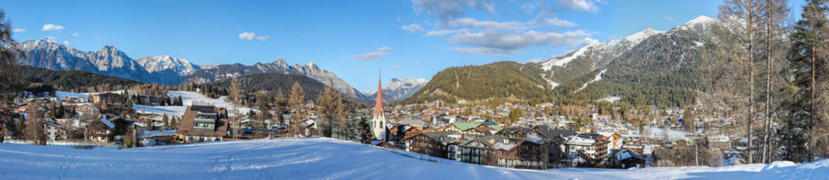Winter panorama of Seefeld village with the church at sunset in in the Tyrolean Alps, Austria