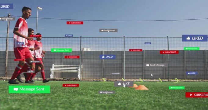 Animation of social media icons over team of diverse male soccer players training on sports field