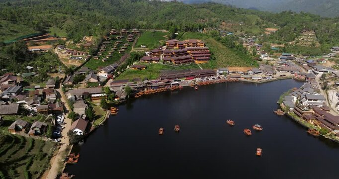 Lakefront Resort Hotel And Cafes At Mok Cham Pae, Mueang Mae Hong Son District, Mae Hong Son, Thailand. Aerial Pullback Shot