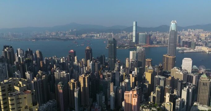 Hong Kong Skyline Across The Victoria Harbour At Sunrise. Aerial Drone Shot