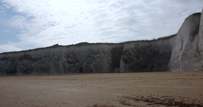 Extra wide panning shots right to left of the Chalk cliffs looking east up botany Bay Beach at low tide. At marine Drive, Broadstairs
