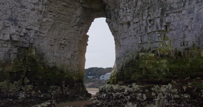 Wide shot of the Kingsgate Arch chalk stack with Kingsgate bay in background.