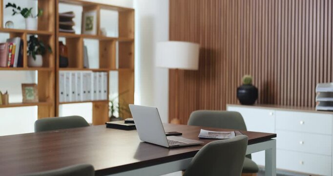 Laptop, documents and internet in empty office for financial company, research and connectivity. Table, computer and paperwork in boardroom with network, finance report and technology for business.