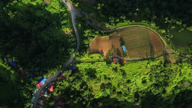 Side ridge angle highlighting sunlit mountains and peaceful rural farmland at Caleruega Batulao Tagaytay Nasugbo Hwy Batangas Philippines