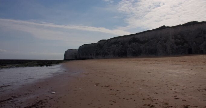Extra wide panning shots left to right of the Chalk cliffs looking east up botany Bay Beach at low tide. At marine Drive, Broadstairs