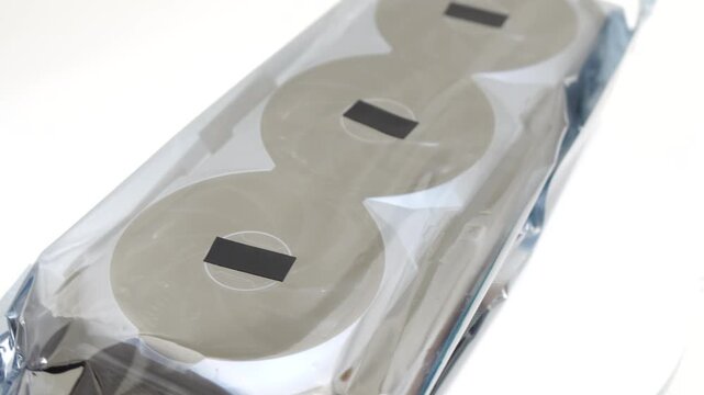GPU graphics card rotating inside protective anti-static bag on white background for high performance gaming computer builds