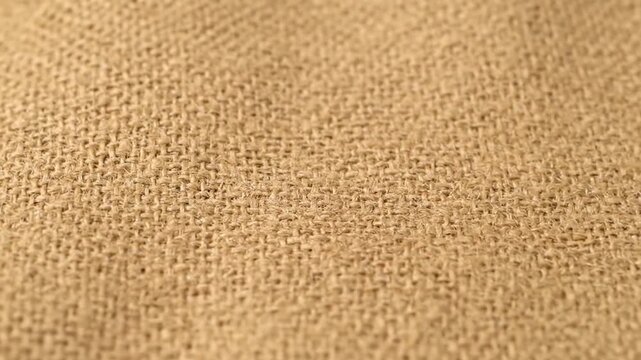Close up of beige knitted fabric texture.