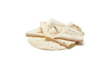 Stack of fresh oven baked flatbread wraps on white