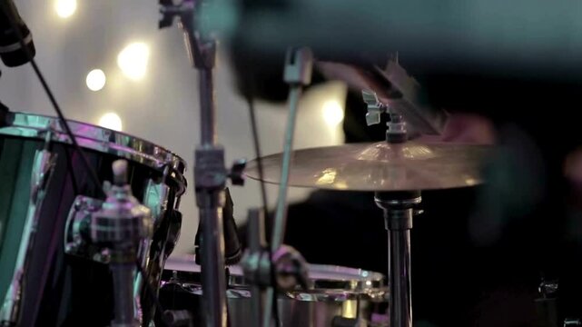 Close-up of drum equipment showing various components such as drumsticks Creates music and art sound Beats drumsticks on different cymbals The drummer