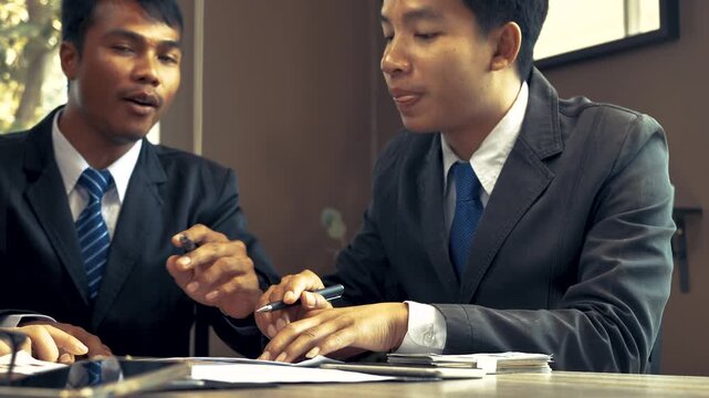 Businessmen discuss and explain their business plans to business partners to persuade them for invest together. 4K
