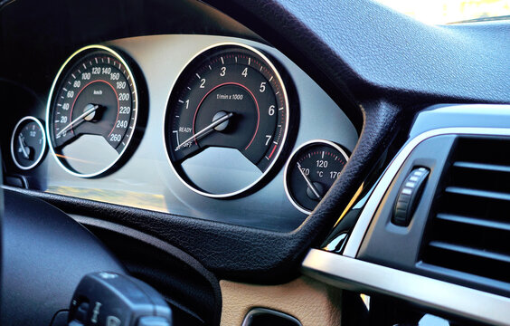 Close up of a car engine temperature gauge on the dashboard showing high temperature warning. Concept of engine overheating in a vehicle.