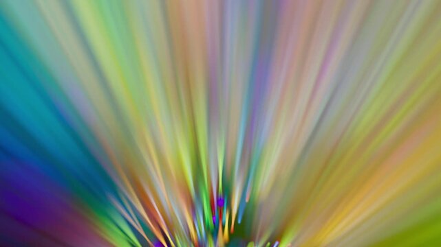 Bright light rays explode in a soft, out of focus kaleidoscope pattern. The blurred lines create a dreamy and ethereal visual experience. 3D render motion.