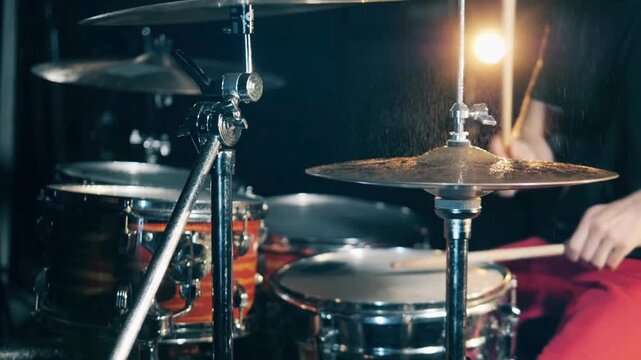 rock band is rehearsing Records a track of his rock band concert Drummer hitting high hat symbal in night concert 4k Percussion musical instrument