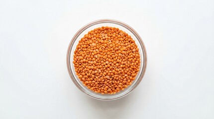 Red lentils in a clear glass bowl