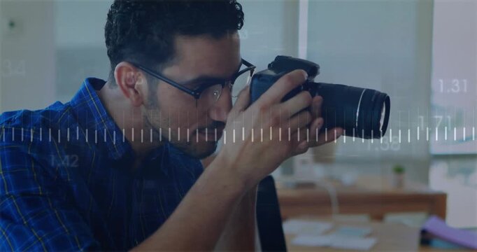 Animation of data processing and diagrams over man taking photo in office