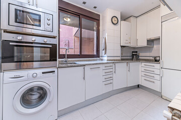 Fototapeta premium an open-plan space where the cooking area with its central island becomes the social hub, visually separated from the living room by a change in flooring