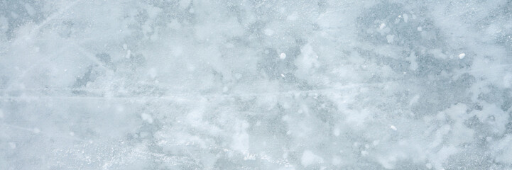 Snowy ice background. Closeup. Wide banner. Top down view.