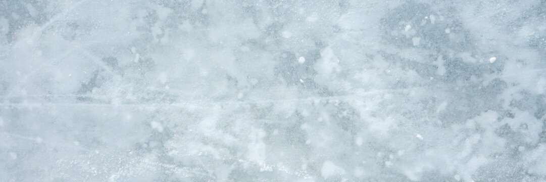 Snowy ice background. Closeup. Wide banner. Top down view.