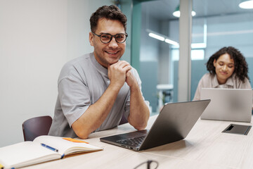 Fototapeta premium Colleagues Unite Around Their Workspace To Mark Significant Professional Accomplishment Joyfully
