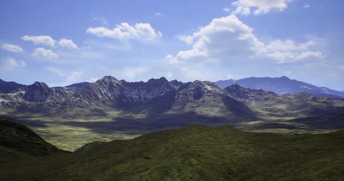Vast mountain range stretches across the horizon with varying heights and textures. Rolling hills in the foreground complement the bright blue sky and fluffy white clouds above.