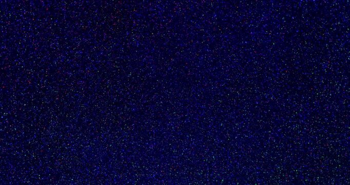 Glitter Smooth rotation. Twinkling  color glitter particles gently  sparkling against black background.	