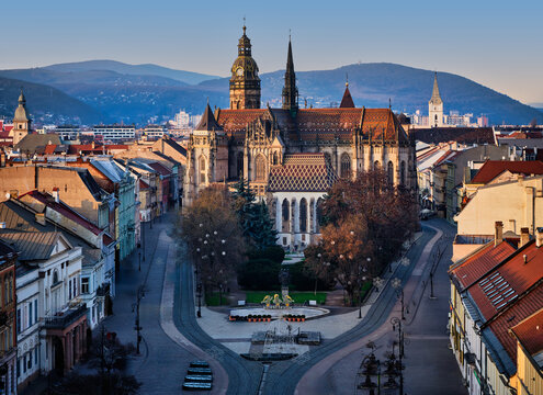 Kosice Cathedral And Historic Street With Tram Tracks At Winter Sunset