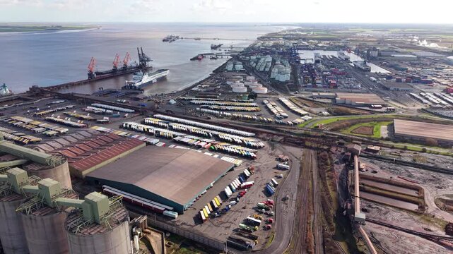 Aerial view of the massive Immingham Port RORO terminal with cargo ships and HGVs during busy shipping operations in the UK