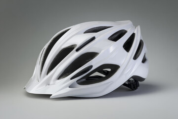 Fototapeta premium white cycling helmet isolated on light gray background, commercial catalog style, even studio lighting, crisp clean shadows, front three-quarter view.