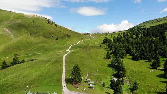 Aerial drone view flying green wild forest in morning after sunrise highland swiss mountain scenary motion nature travel destination