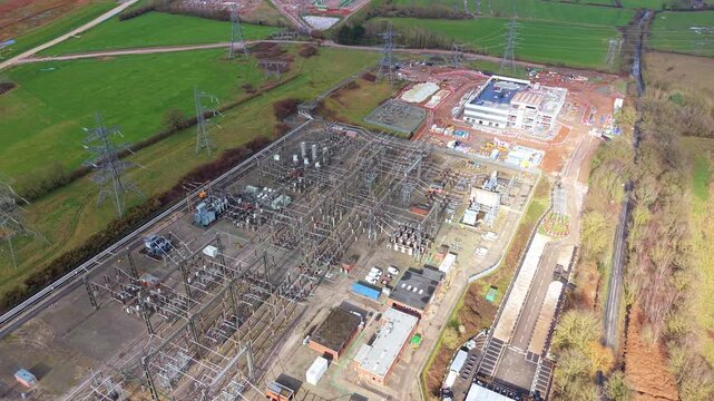Aerial view of Hams Hall National Grid substation with high voltage pylons and busbars.
