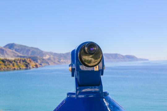 Scenic viewfinder overlooking a tranquil ocean at sunset