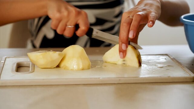 How to easily slice a pear in a kitchen setting without any fuss