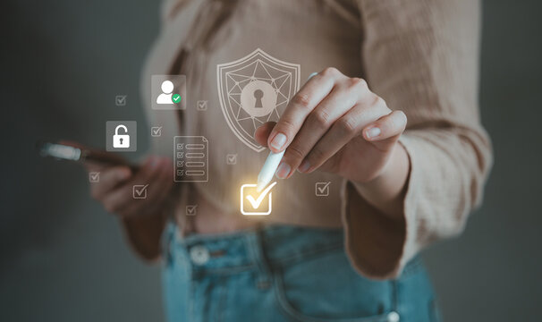 Person using stylus to select virtual check mark on privacy checklist near padlock shield for GDPR consent concept, personal data protection consent, Agreement Authorization Verification