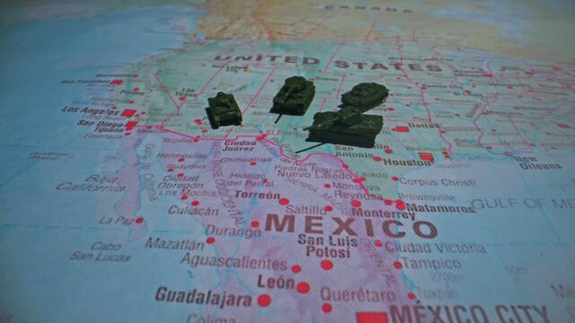 Military patrol and border security on USA Mexico map.