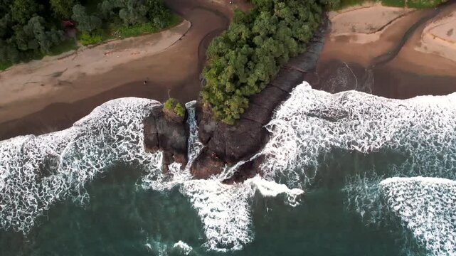 Aerial view of twin channels meeting the sea on Java south coast