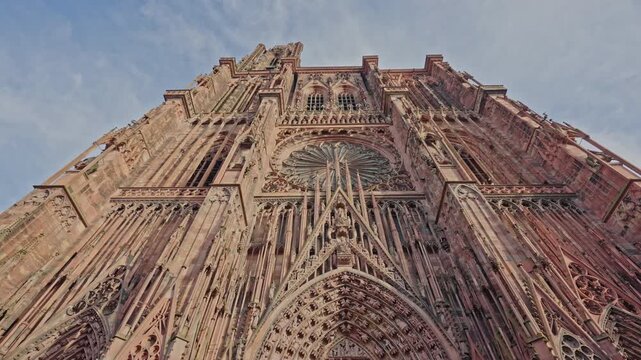 Low Angle View of Strasbourg Cathedral Gothic Facade Against Blue Sky.Filmed on 18 December 2025.