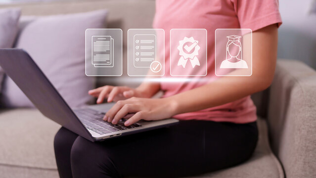 Student completes online course on laptop for degree certification and skill development ensuring quality standards and knowledge online learning certification graduation