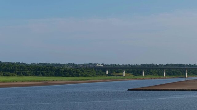 Liverpool, Merseyside, UK, June 19, 2025; Aerial 4K video footage of the Mersey Gateway toll bridge with stunning views over the River Mersey, Liverpool, UK.