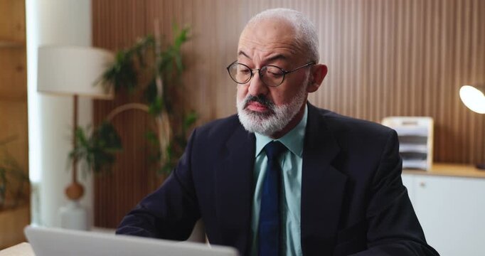 Review, laptop or man in office for evaluation, reading digital application or bank loan processing. Funding eligibility, pc or mature credit analyst with online screening, request status or approval