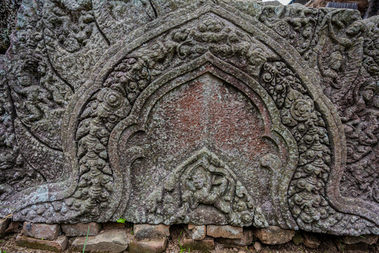 Ancient stone lintel with intricate Khmer carvings at Phnom Chisor temple