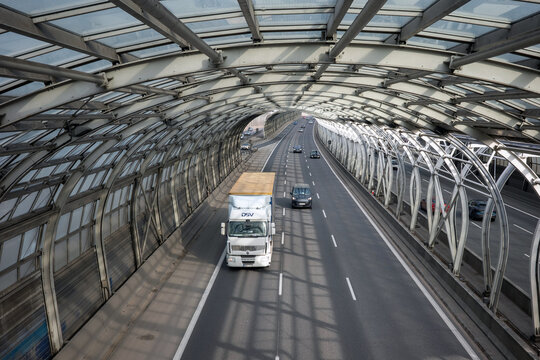 WARSAW, MASOVIAN, POLAND - FEBRUARY 27, 2026: A white DSV semi-truck drives through the glass noise-reduction tunnel on the S8 expressway