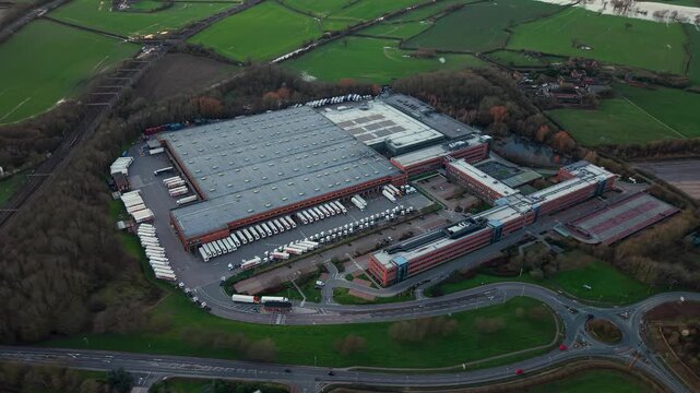 Aerial view of the busy logistics sector in Atherton showing a giant distribution hub with active HGV traffic and export operations