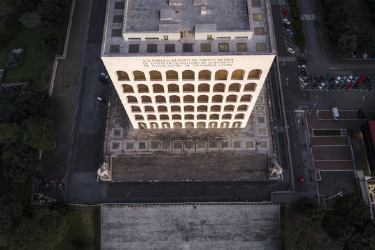 Rome, Italy - 21 February 2026: Aerial view of the Palazzo della Civilt&agrave; Italiana with its iconic arches and marble statues under soft evening light in Rome, Italy.