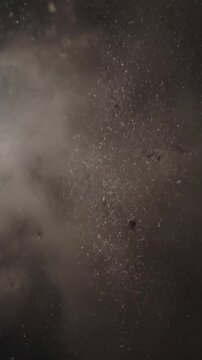 Abstract Swirling Voids Capture the artistic, non-representational patterns formed by the interaction of soft motes and smoke in an undefined space.