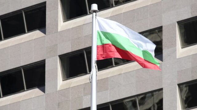 The Baulgarian flag on a flag pole at Toronto City Hall&rsquo;s Nathan Phillips Square.

