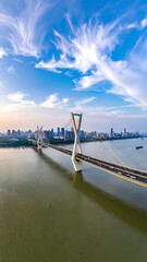 Fototapeta premium Aerial view of a cable-stayed bridge spanning a wide river
