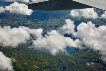 Fototapeta premium aerial perspective,captured moments before landing at Alejandro Velasco Astete International Airport, offers a first glimpse of the rugged beauty and agricultural heritage surrounding Cusco, Peru. 